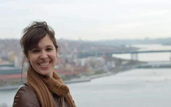 Danielle Schoon - Smiling woman with body of water in background